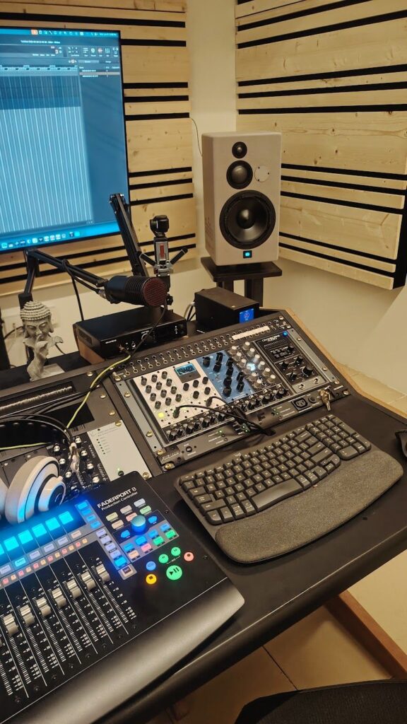 Steam Mastering studio - set up for video view of Steam Mastering studio showing 500 series processors, keyboard, SE DCM 8 microphone and DJI camera for filming instagram video